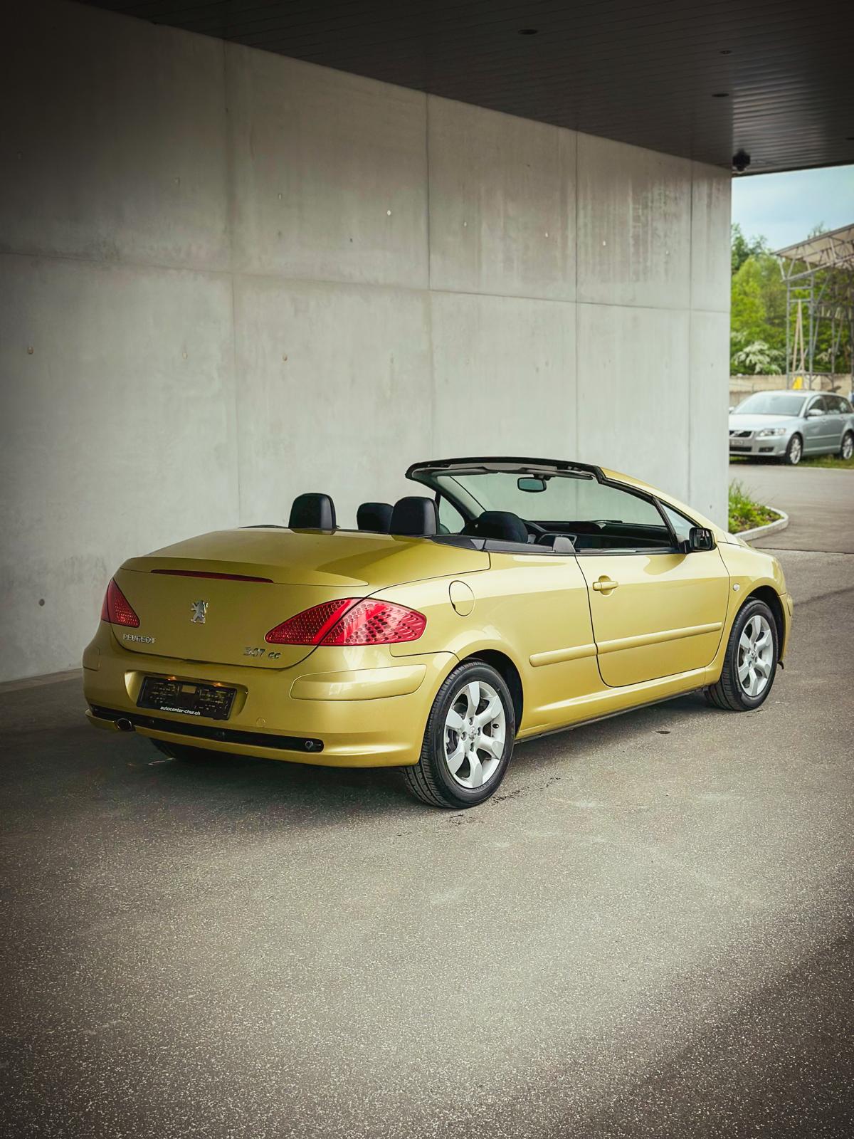 Peugeot 307 CC rear three-quarter view with the roof open