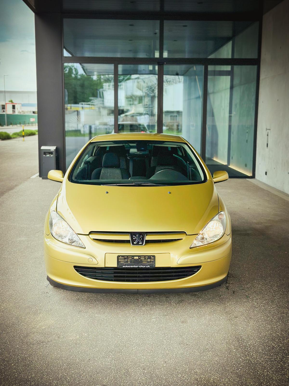 Peugeot 307 CC from the front with the headlights on