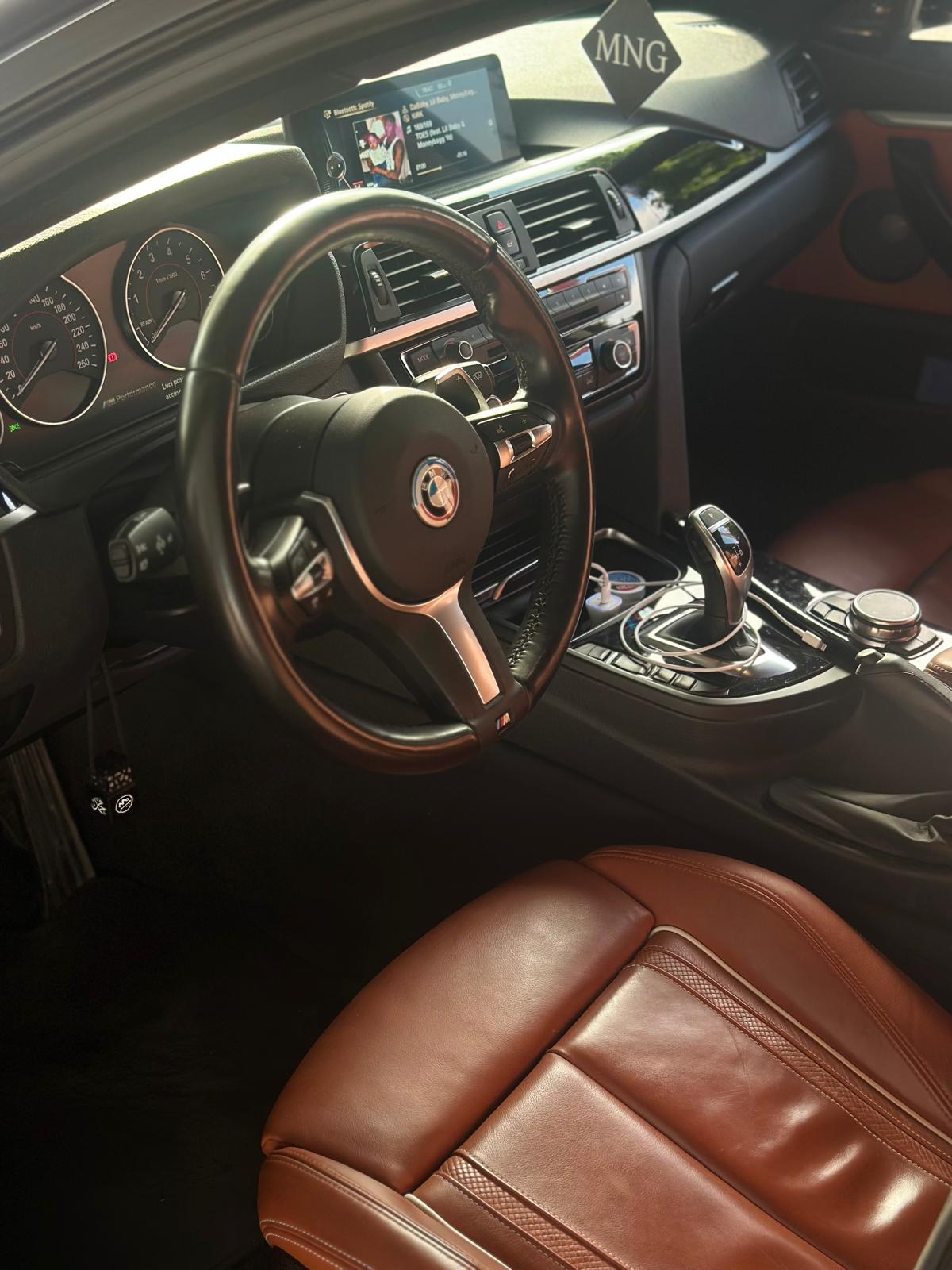 BMW 435i Gran Coupé dashboard with M steering wheel and cognac leather